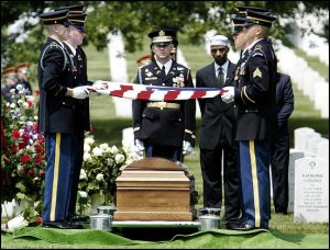 Life and times of Khizr Khan's son: fallen US Army Capt. Humayun Khan 1 slug: me/khan date: 15 june 2004 photog: Gerald Martineau location: Arlin gton National Cemetary neg: 156686 summary: Funeral for fallen soldier killed in Iraq. caption: The nonor guard prepares to fold the flag that draped the casket of Army Captain Humayun Khan who was killed in Iraq. Captain Roland Dicks, center, commands the opereation and Imam Mutee Mulazim stands beside him. StaffPhoto imported to Merlin on Tue Jun 15 16:56:05 2004